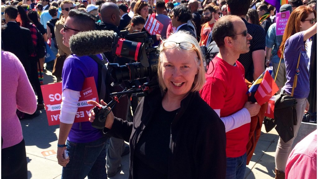 DP Claudia Raschke in front of the supreme court in DC surrounded by protesters-and-activists Photo by Eddie Rosenberg